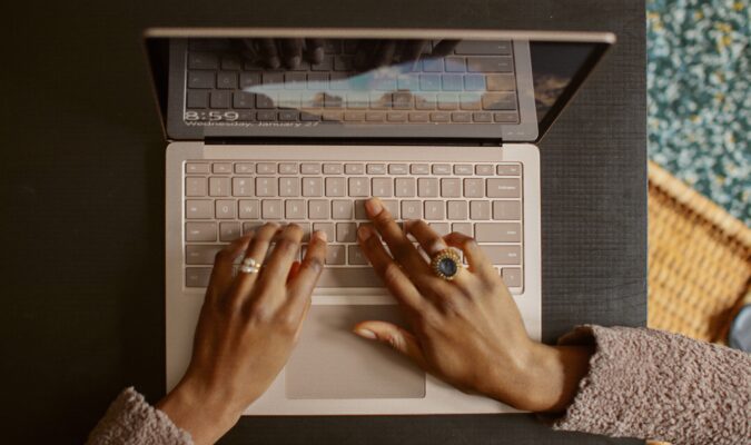 Photo of a person using their laptop